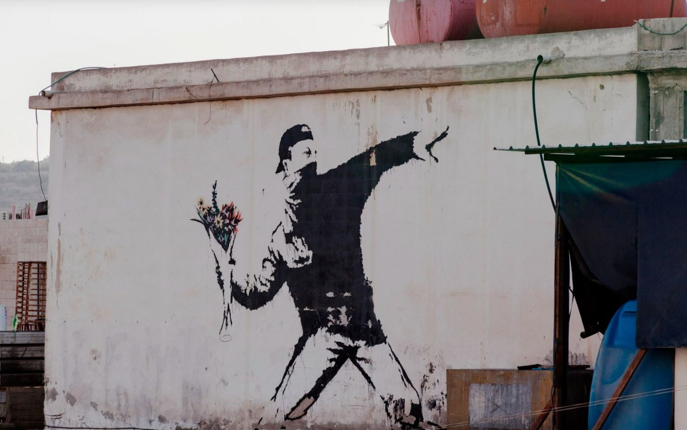 Banksy, Beit Sahour, Palestine, 2005. Photo: © PHOTOBYTE / Alamy Stock Photo. Artwork: © Banksy / Courtesy of Pest Control Office, Banksy.