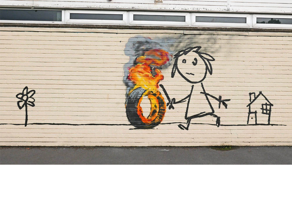 Kid Rolling A Burning Tire, Bristol, January 2016