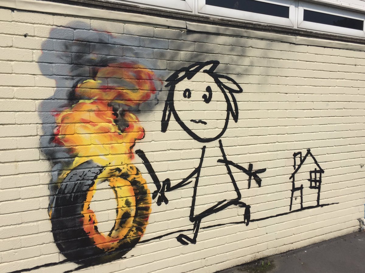 Banksy, Kid Rolling A Burning Tire mural