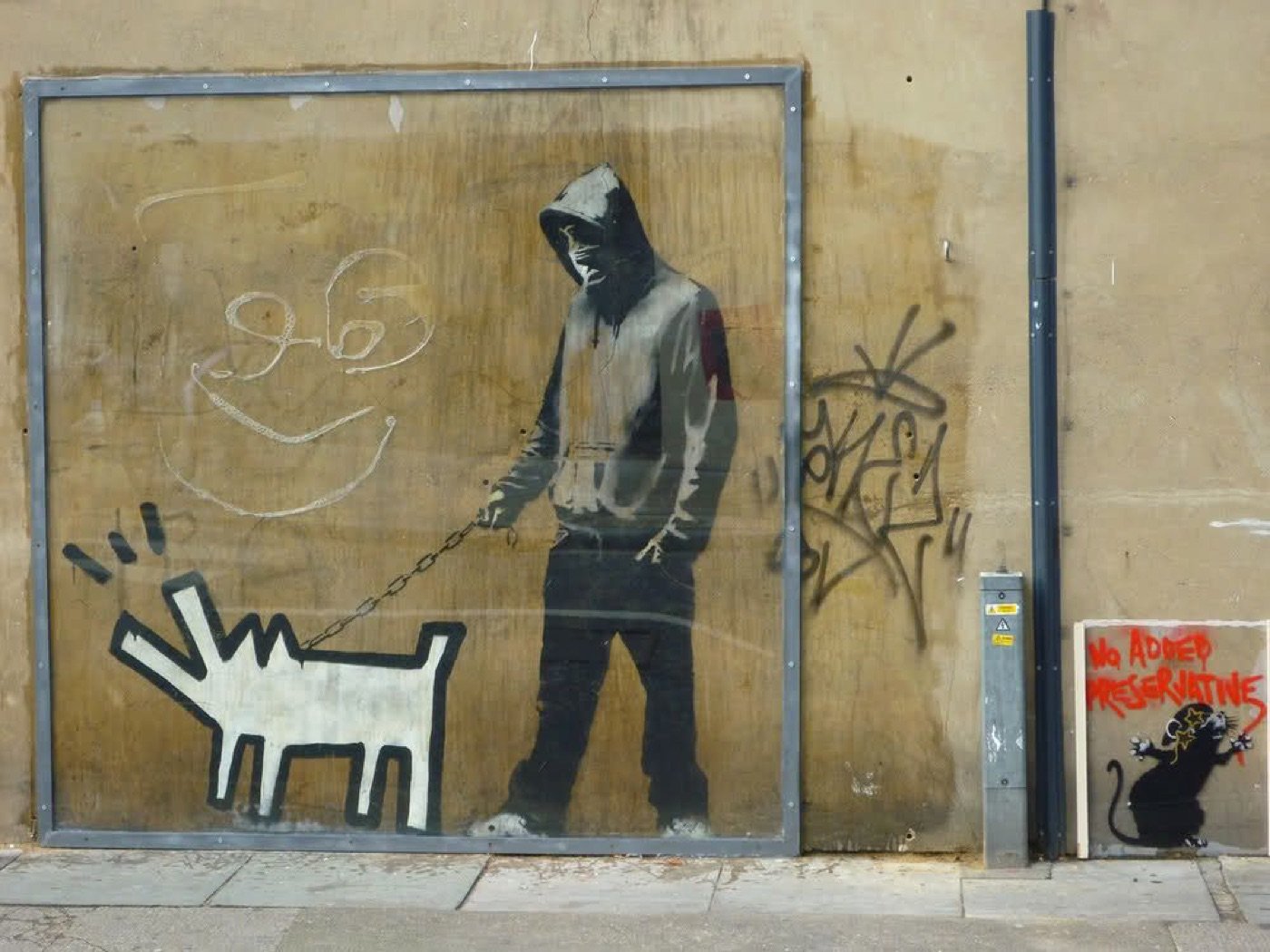 The mural boarded over, reframed and covered in Perspex.