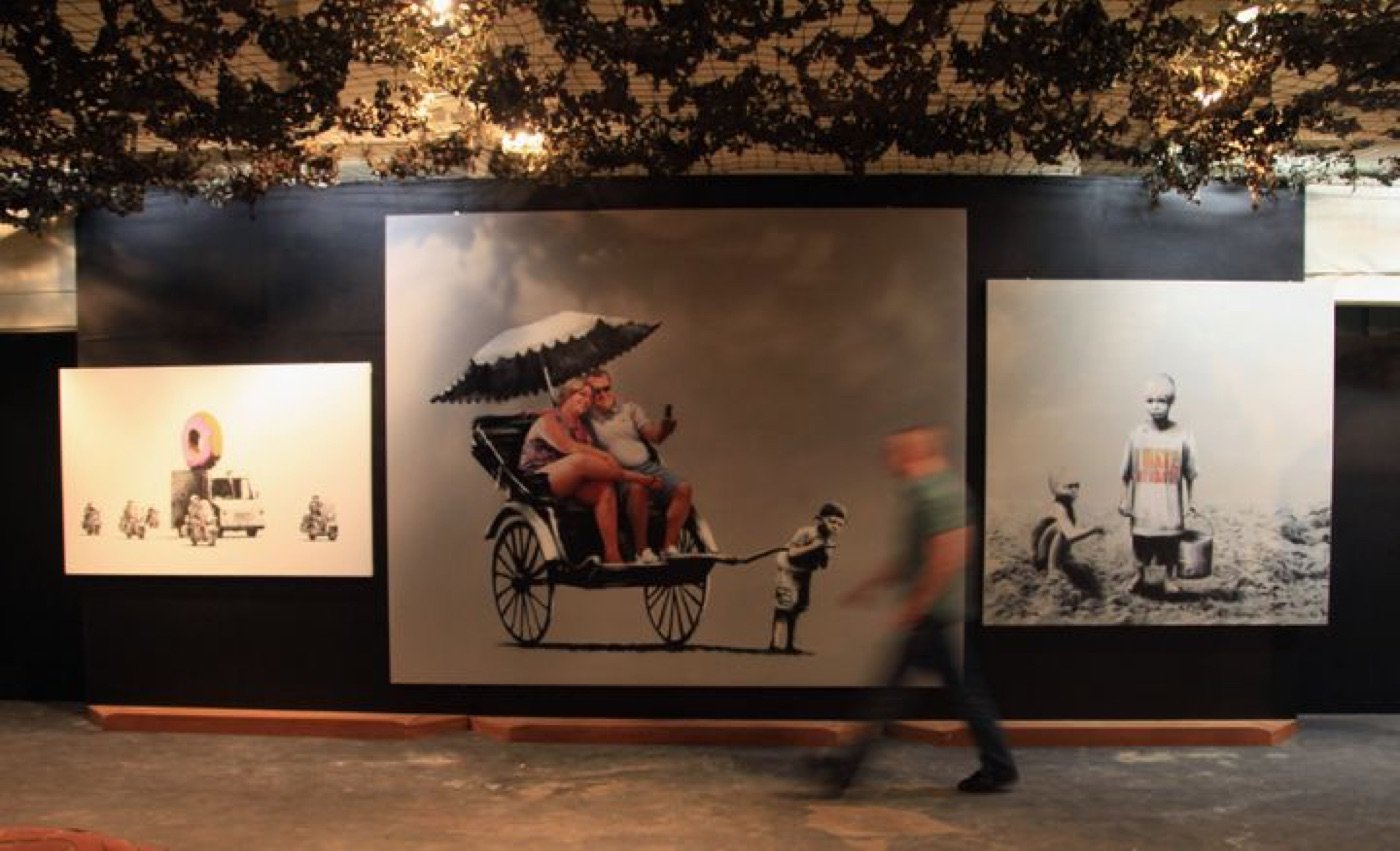 The Strawberry Donut original (left), exhibited at Banksy vs. Bristol Museum, 2009.