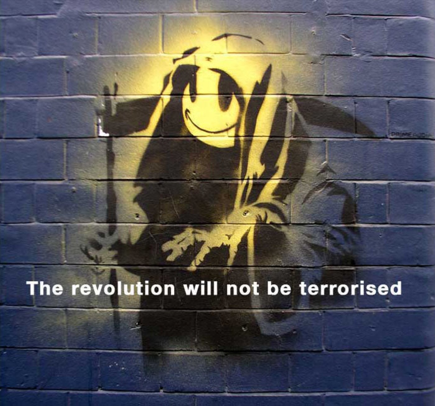 The motif on a London wall, with the line “The revolution will not be terrorised”.