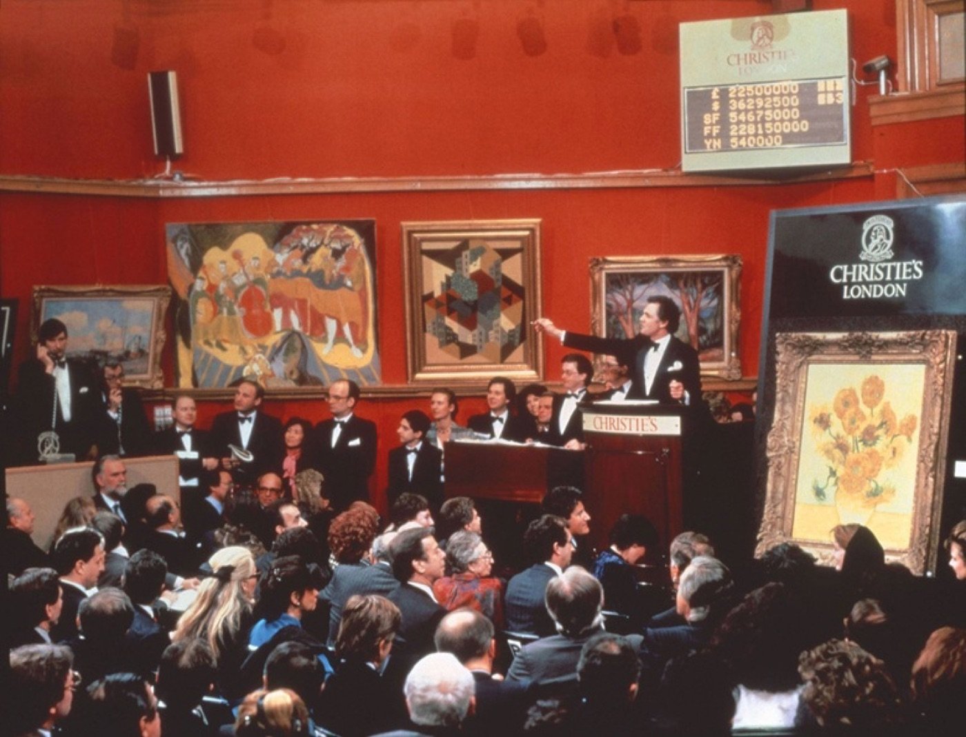 The scene Banksy reworks: Van Gogh's Sunflowers under the hammer at Christie's London, 1987.
