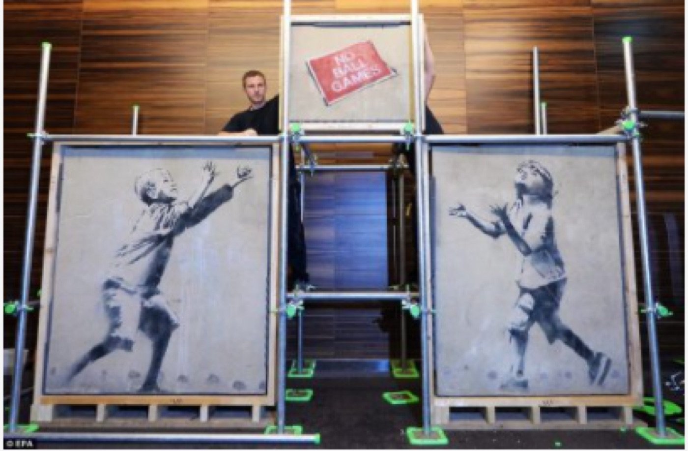 The Tottenham mural being removed from the wall, 2013.